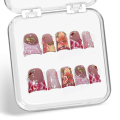 Handemade press-on nails with water droplets for a chic short look.