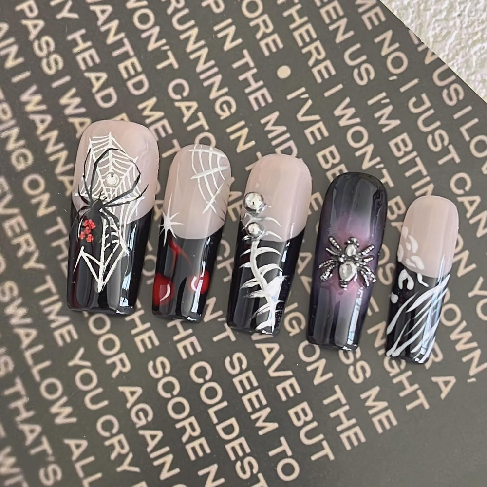 Handmade press-on nails Halloween art spider pattern for festive nail art.