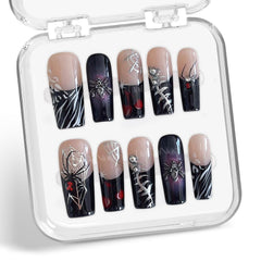Handmade press-on nails with spider web full-cover design for dramatic Halloween style.