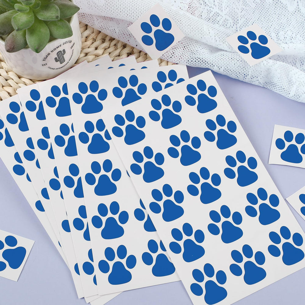 Harloon colorful blue paw tattoos that stand out on skin.