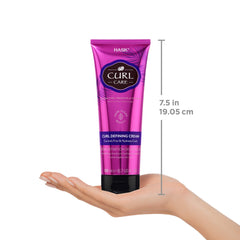 HASK applying hair cream on damp curls for smooth definition.