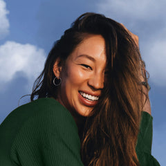 Herbal Essences Volume-Boost hair application shows root lift and body.
