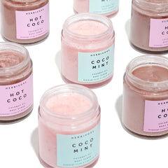 HERBIVORE Coco Mint Body Scrub texture closeup shows creamy oils and gentle exfoliation.