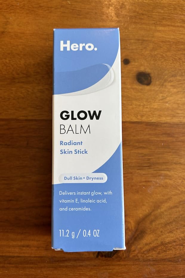 Hero Cosmetics Glow Balm in purse for on-the-go glow touch-ups