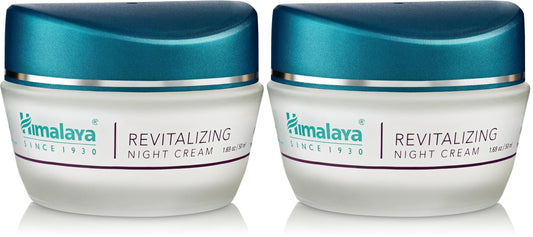Himalaya Revitalizing Night Cream bottle glows softly, offering overnight hydration for refreshed morning skin.