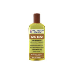 Hollywood Beauty Tea Tree Oil bottle pour for refreshing skin care and daily cleansing.