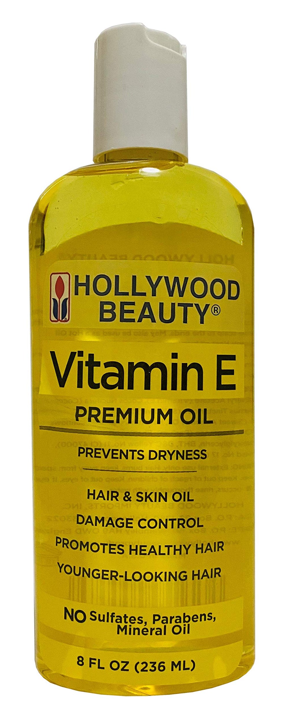 Hollywood Beauty Vitamin E Oil bottle close-up for hair and skin hydration.