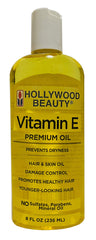 Hollywood Beauty Vitamin E Oil bottle close-up for hair and skin hydration.