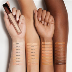 Hourglass Vanish Airbrush Concealer under-eye swatch showing brightening effect.