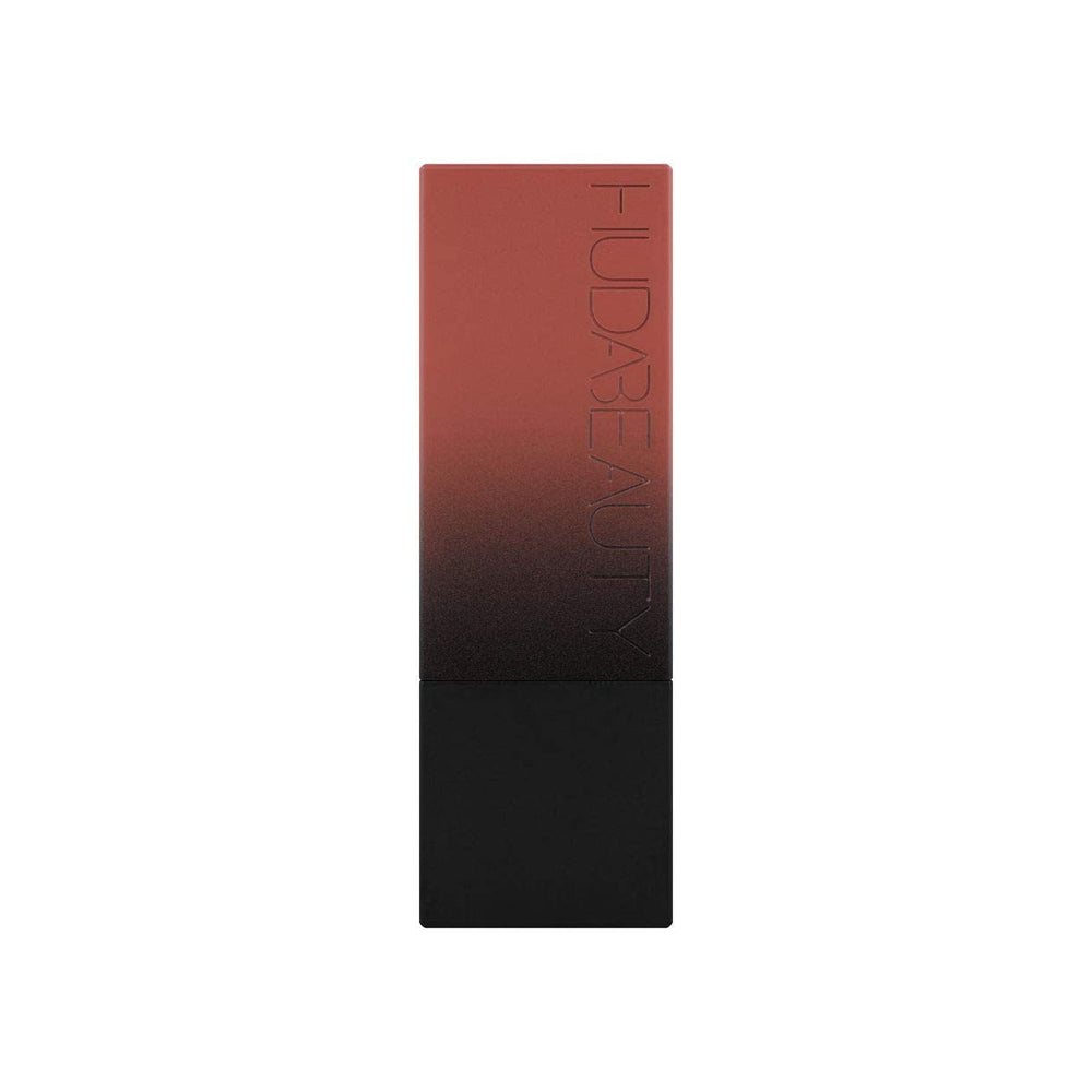 Huda Beauty Power Bullet Interview on lips reveals defined edges and modern look.