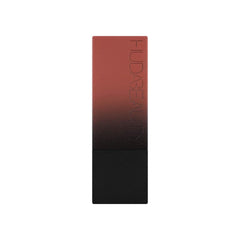 Huda Beauty Power Bullet Interview on lips reveals defined edges and modern look.