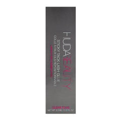 HUDA Beauty Sticky Tack Lash Glue applied to lashes for secure hold.