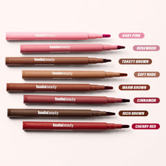 Huda Lip Contour Stain versatility across skin tones with warm brown shade.