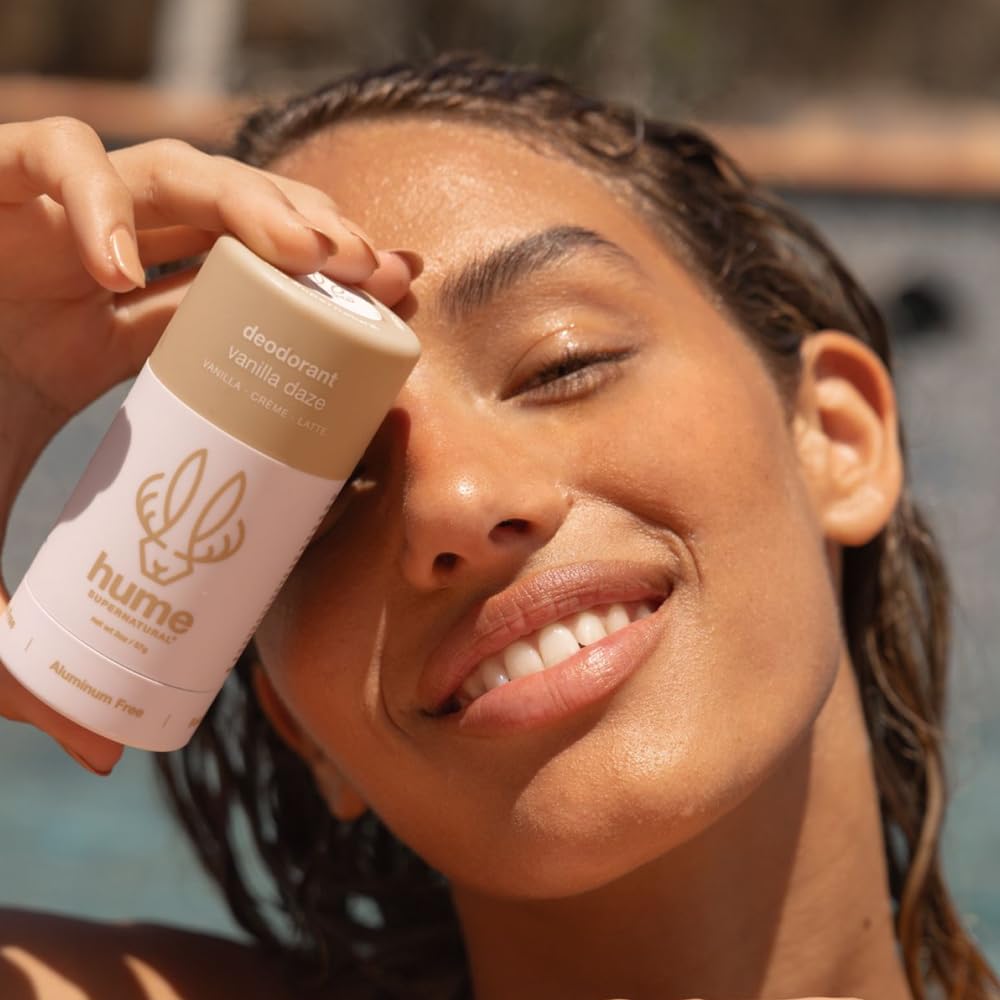 HUME Vanilla Daze deodorant stick in use delivering a dry, odor-free underarm feel.