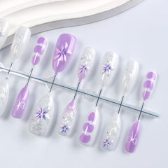 HZJXRT 3D flower details on nails for a delicate date-night look.
