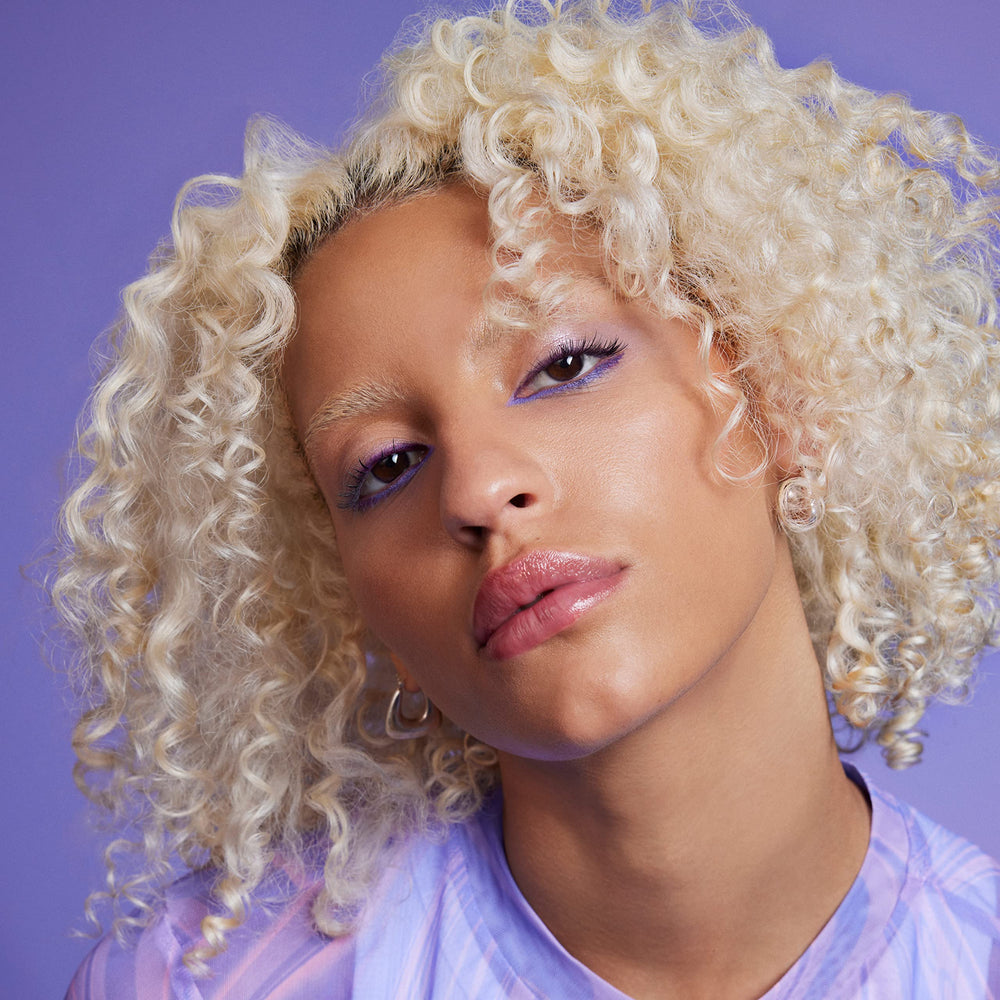 IGK Blonde Pop on blonde locks shows vibrant, brass-free results.