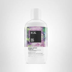 IGK Pay Day Shampoo bottle under lighting showcases sleek design and branding.