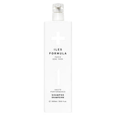 ILES FORMULA Shampoo bottle pouring hydrates hair for easy styling.