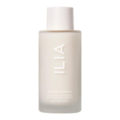 ILIA Base Face Milk Essence bottle closeup shows hydrating formula for daily use