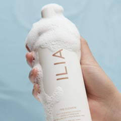 ILIA Cleanse applied to skin, showing soft foam and refreshed feel after wash.