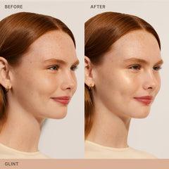 Applying ILIA Lightshift Cream Highlighter with brush for precise glow
