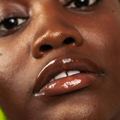 Innbeauty Project Glaze Lip Oil in lifestyle shot suggests everyday glow.