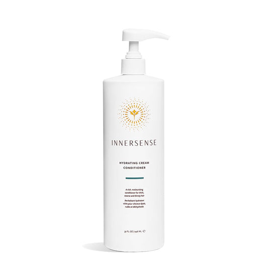 INNERSENSE Organic Hydrating Cream Conditioner bottle pouring for deep moisture in thick, coarse hair.