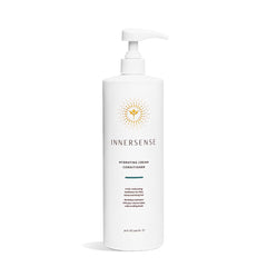 INNERSENSE Organic Hydrating Cream Conditioner bottle pouring for deep moisture in thick, coarse hair.