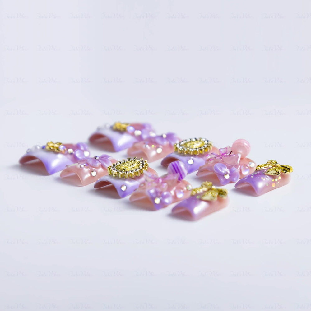 IntoVibes 3D flowers and lollipops nails elevate party-ready manicures.