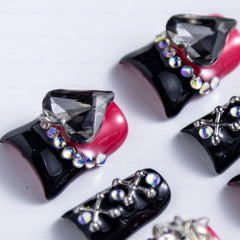 IntoVibes black hearts nail art enhances romantic style with subtle contrast.