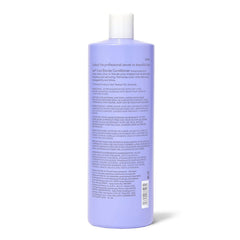 Applying ion Cool Blonde Conditioner to damp hair for smooth color