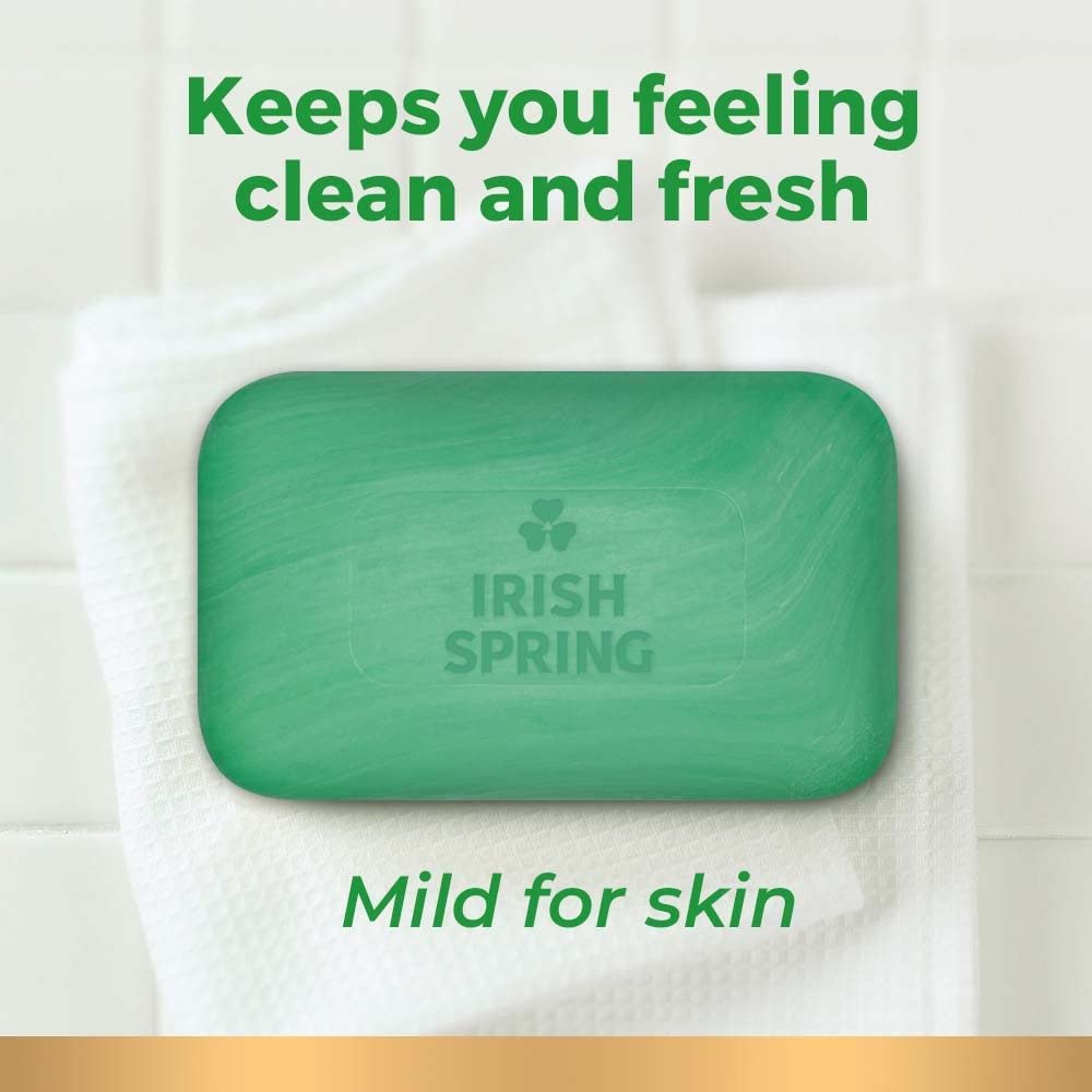 A hand holds Irish Spring Aloe bar soap ready for a quick wash.