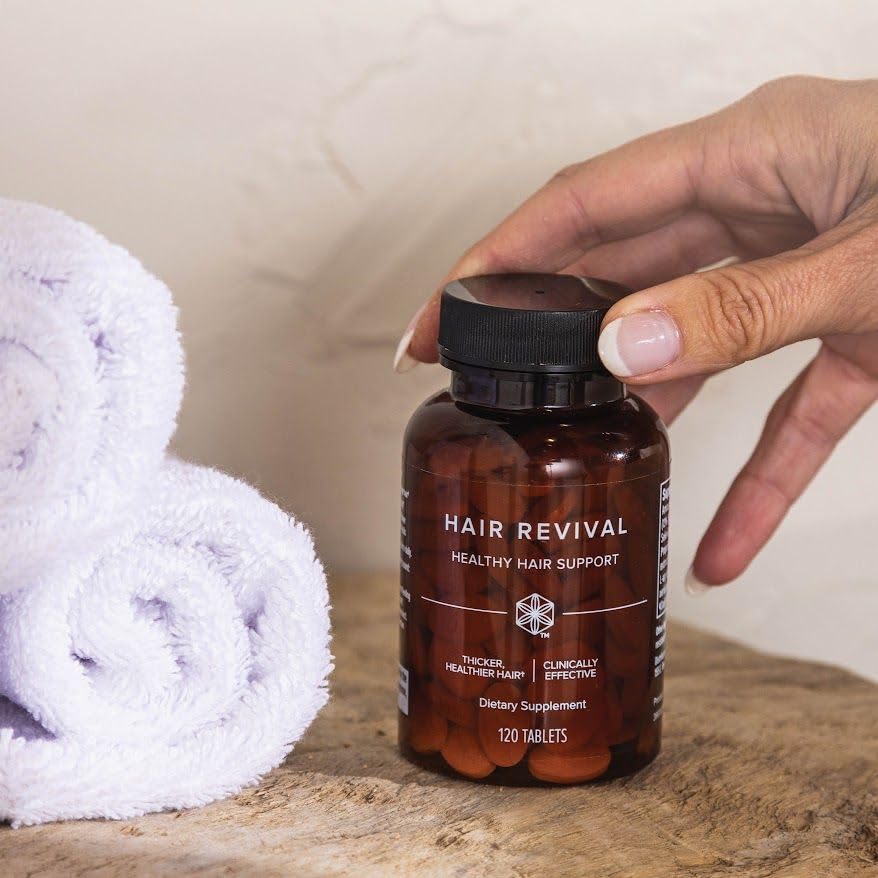 Isagenix Hair Revival product shot on a clean surface, signaling premium quality and care.
