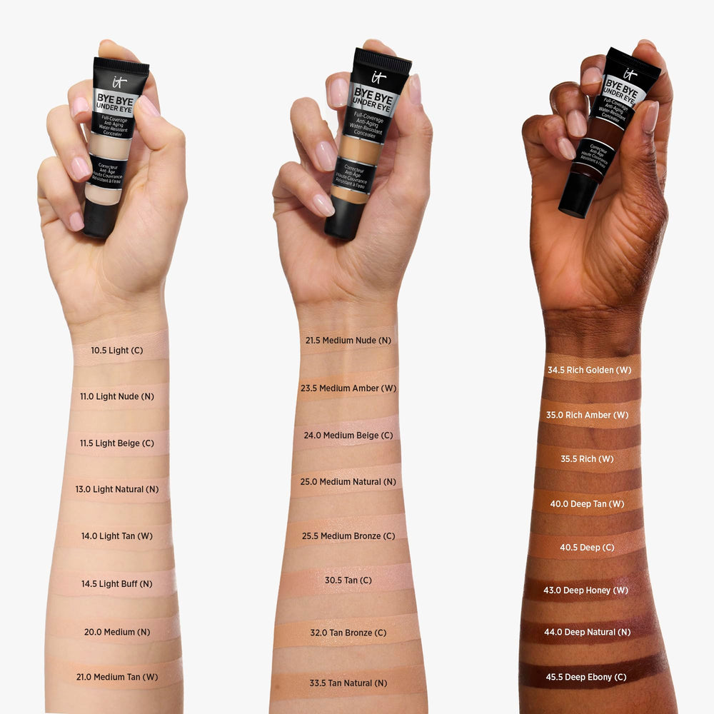 Applying IT Cosmetics Bye Bye Under Eye Concealer under-eye for brightened, smooth finish.