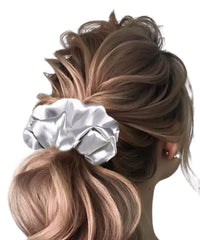 Iuptown Chic gold satin scrunchie for sleep hair protection.