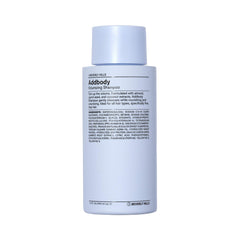 J Beverly Hills Blue Addbody Shampoo bottle highlighting volumizing formula.
