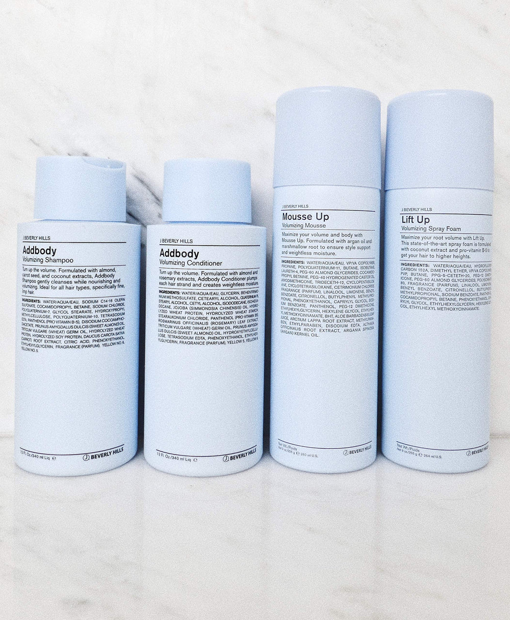 Vitamin E oil label shown on J Beverly Hills Blue Addbody Shampoo.