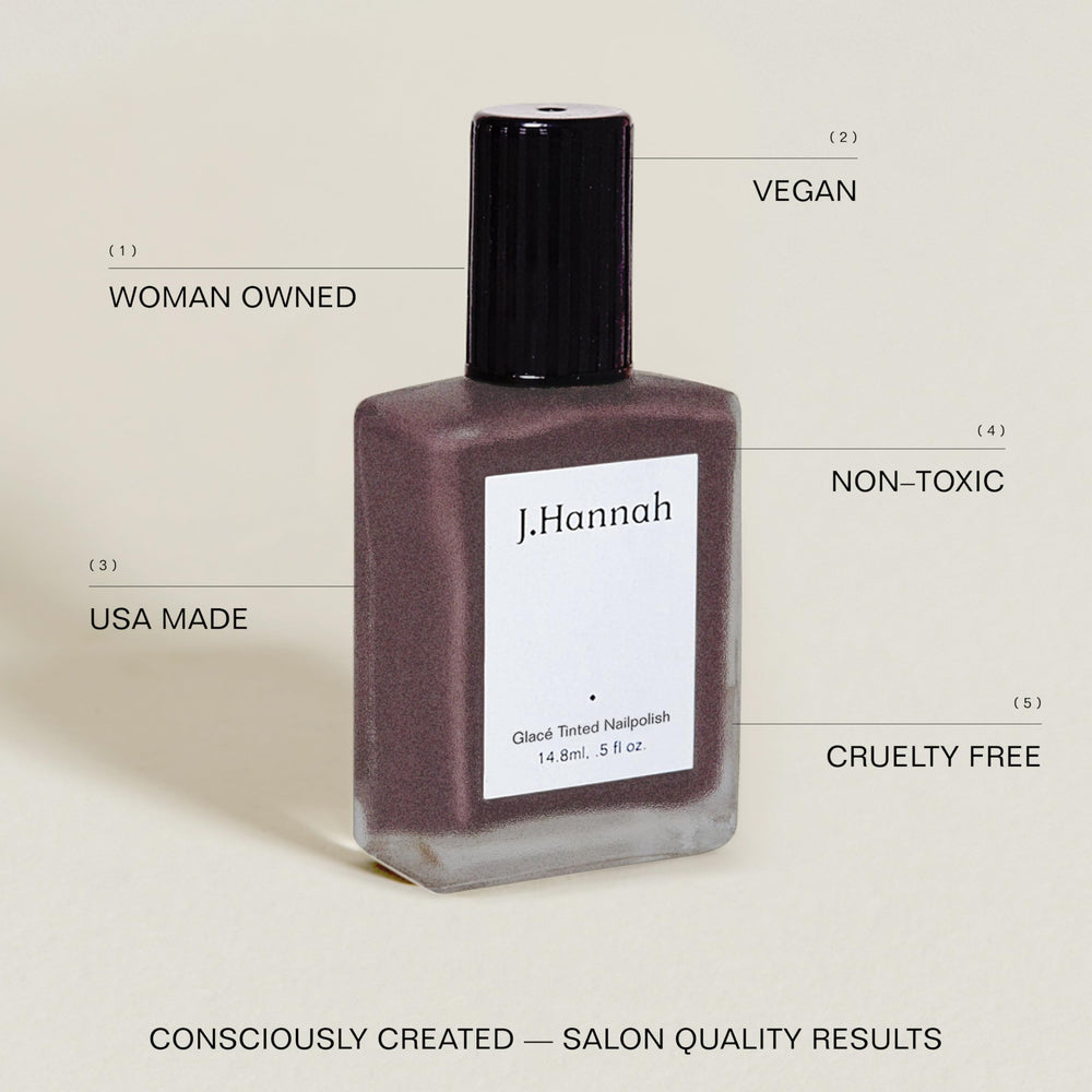 J. Hannah nail polish bottle with brush for precise, even application.