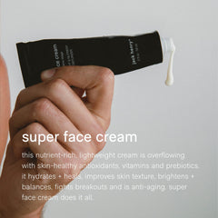Jack Henry Super Face Cream spread on hand demonstrates easy massaging for daily routines.