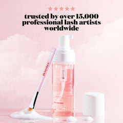 JB LASHES 5.1 oz bottle on vanity for daily lash care.