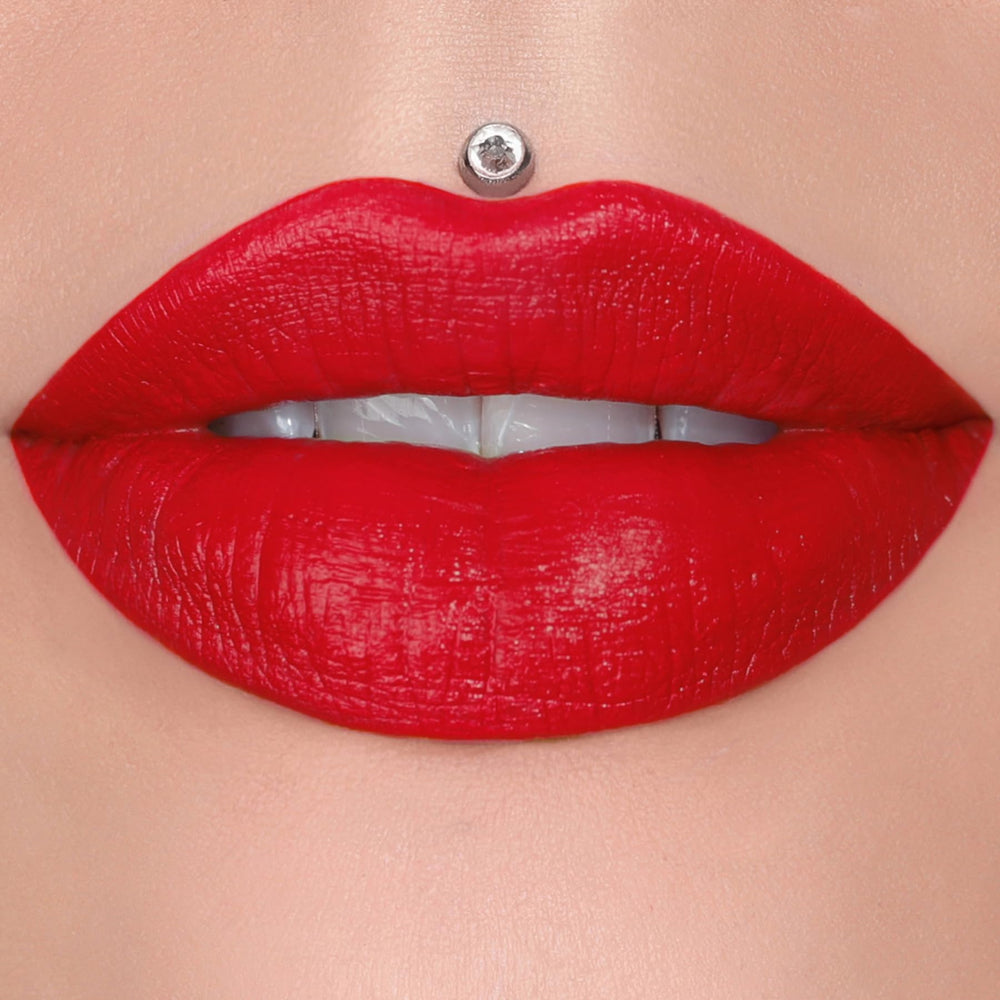 Jeffree Star Velvet Trap Red Affair swatch on skin, bold red pigment