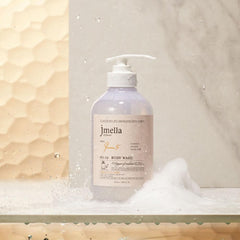 jmella Queen5 Body Wash being poured to reveal creamy lather