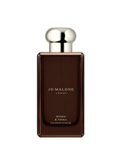 Jo Malone Myrrh & Tonka bottle front view, premium fragrance packaging for a refined evening mood.