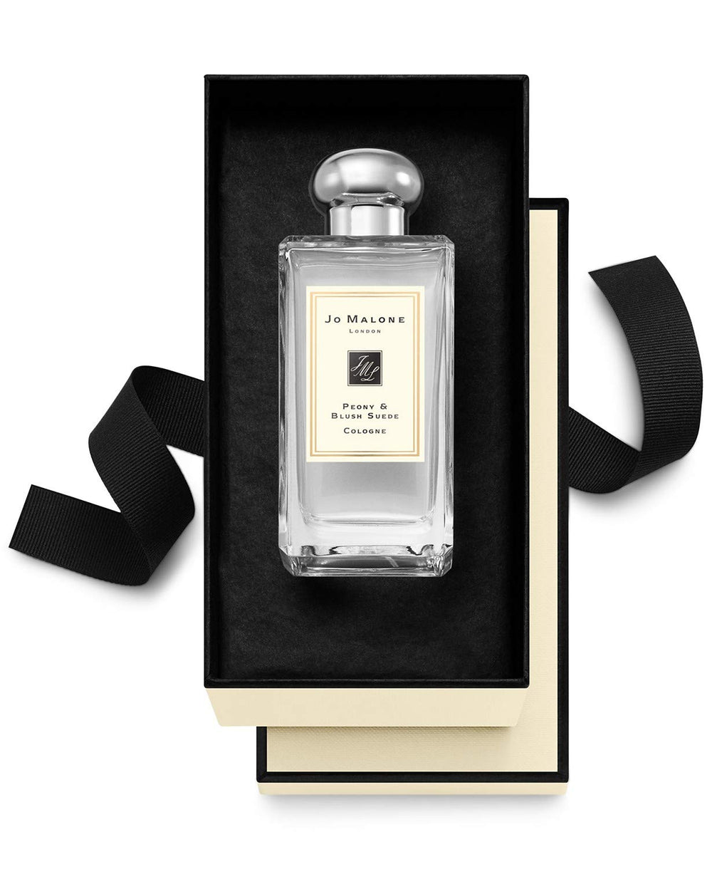 Jo Malone Peony & Blush Suede application close-up, showcasing luxurious scent layering possibilities
