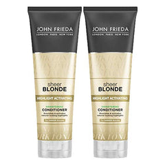 Close-up applying conditioner to dark blonde hair for reactivated highlights