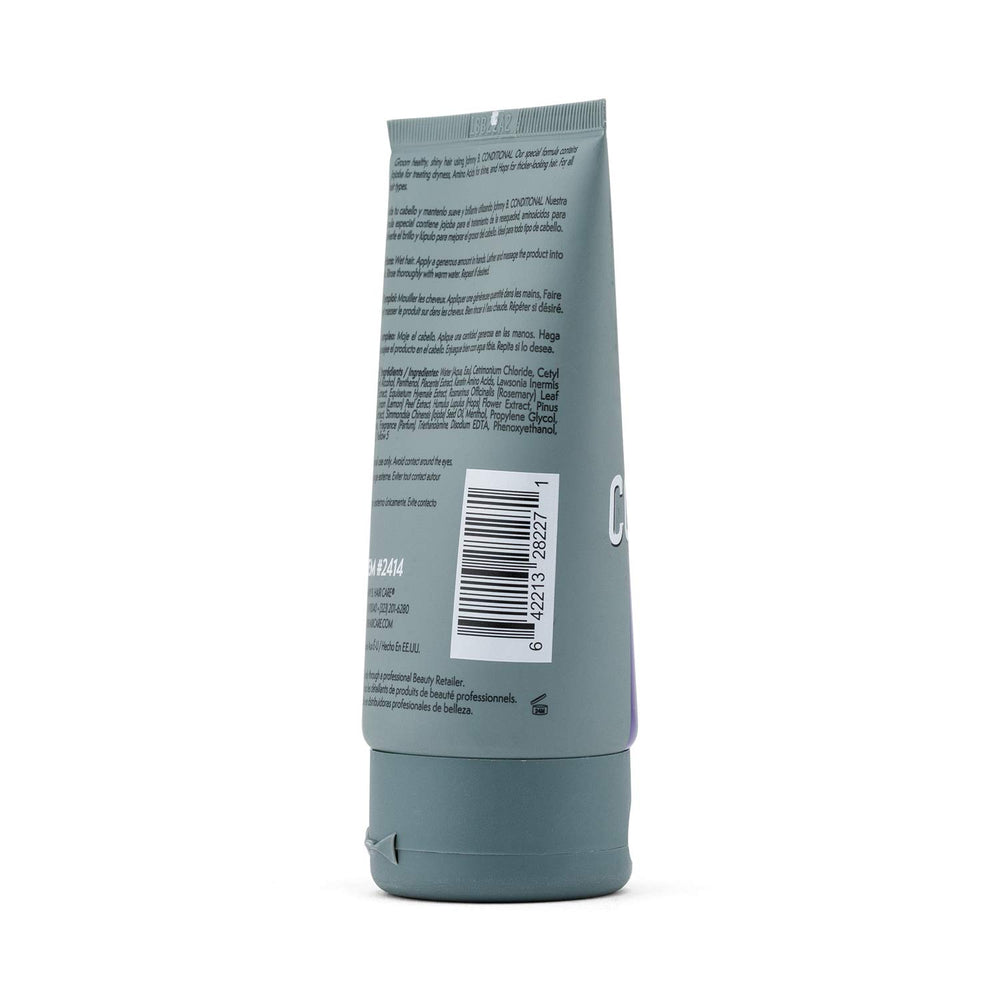 JOHNNY B. Conditional Conditioner bottle dispensing highlights shine and dryness relief.