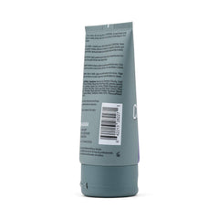 JOHNNY B. Conditional Conditioner bottle dispensing highlights shine and dryness relief.