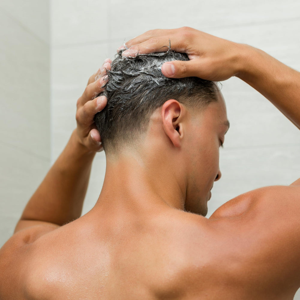 Johnny B. Professional Grow Hair Shampoo removes buildup for stronger, cleaner hair.