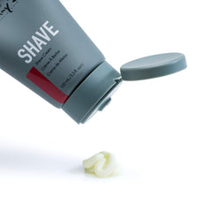 Johnny B shave cream tube silhouette showing silky glide for a close shave.