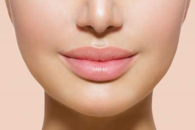 Jolie Vitamin E lip conditioner stick closeup delivers hydration and smoothness.